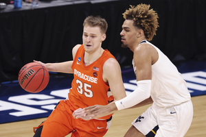 Buddy Boeheim took over the game, the 2-3 zone tightened up, and the Orange avoided a second-half collapse to West Virginia.